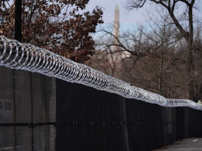 Following the January 6 insurrection, a seven-foot, non-scalable fence was added around the Capitol Hill complex. Barbed wire sits atop the fence, providing an additional barrier to entry to the grounds.