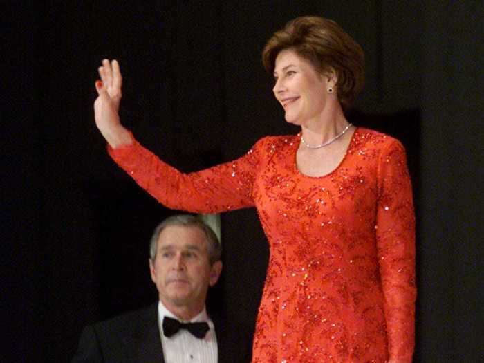 January 20, 2001: Laura Bush attended the Texas inaugural ball in a red gown by Texas designer Michael Faircloth.