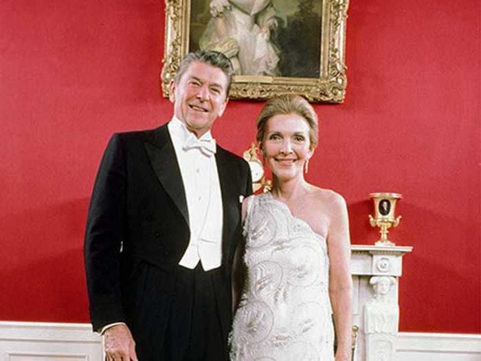 January 20, 1981: Nancy Reagan wore a gorgeous one-shouldered lace gown over silk satin to the inaugural balls.