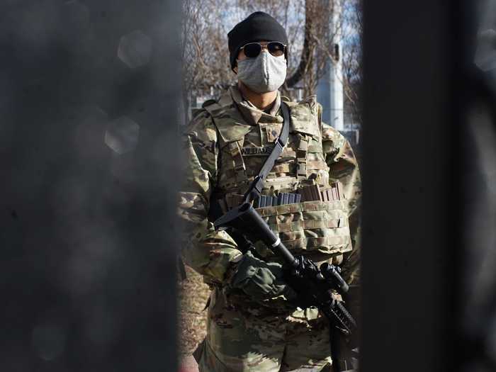 A soldier from the 29th Infantry Division of the Virginia National Guard at the Capitol on Pennsylvania Avenue.