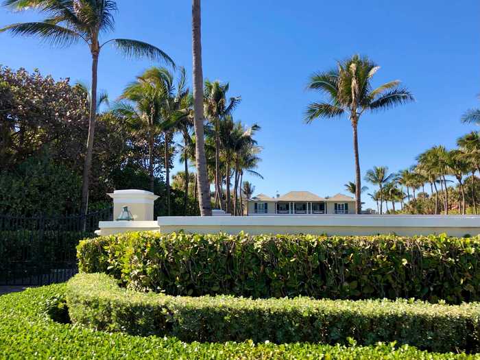 Some homes are set farther back on their lots, hidden behind both hedges and fences. This mansion belongs to billionaire Bill Koch.