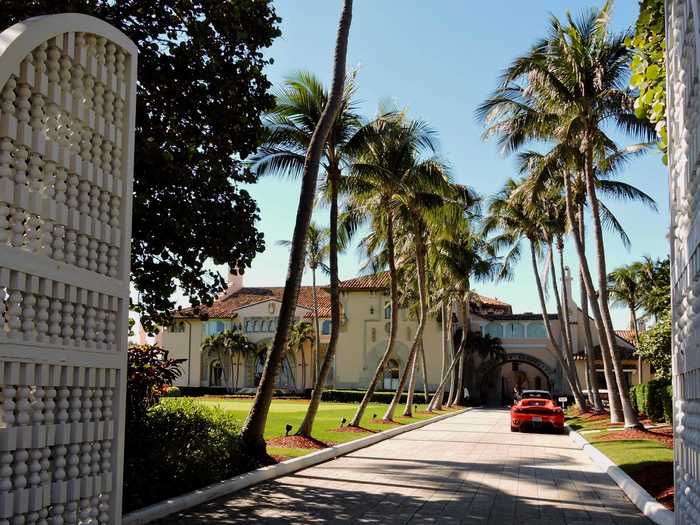 There was a car valet under a portico just beyond the main gate. I spied a red Ferrari parked out front.