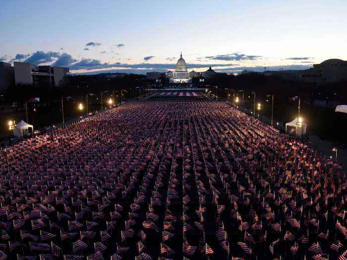 But this year, following the deadly insurrection at the US Capitol on January 6, the National Park Service shut down access to the National Mall. Nearly 200,000 US flags planted on the Mall represent the people unable to attend.