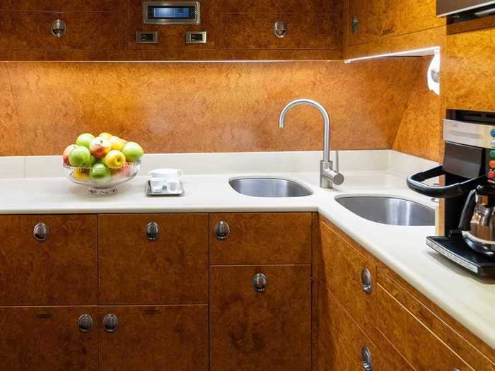 In the front of the plane is the galley, or the main workstation for the flight attendants onboard, where onboard meals and beverages are crafted