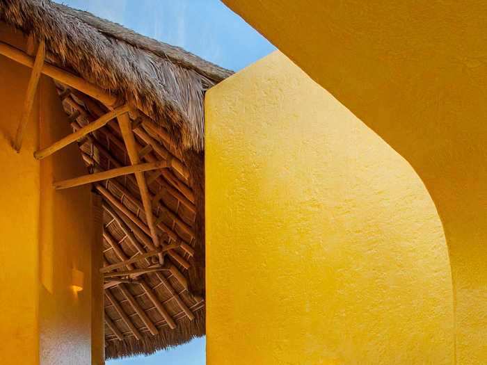 The thatched roof spotted in the living room is a common feature of the property and all four buildings appear to have it.