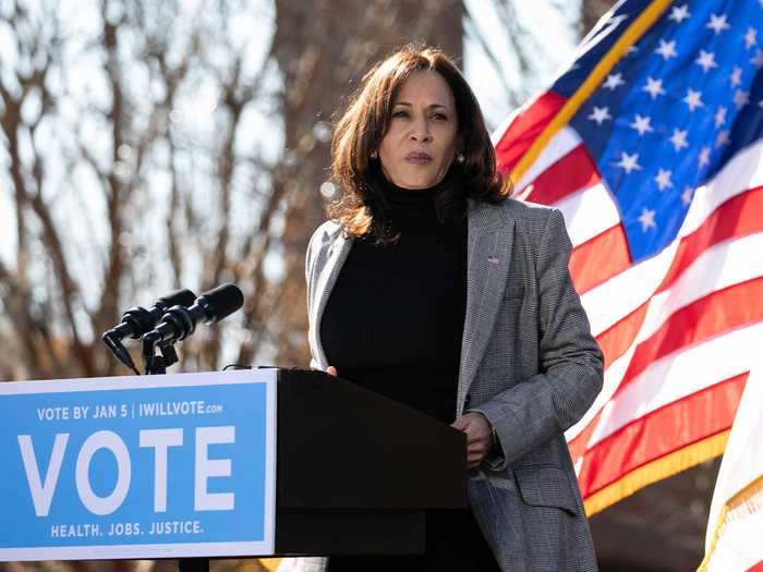 While campaigning in support of Georgia Democratic Senate candidates Rev. Raphael Warnock and Jon Ossoff, Harris paired a simple black turtleneck with a gray suit jacket.