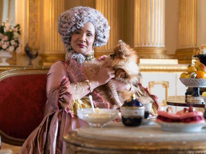 Queen Charlotte, as one would expect, is a commanding character. The tiaras, earrings, and necklaces she