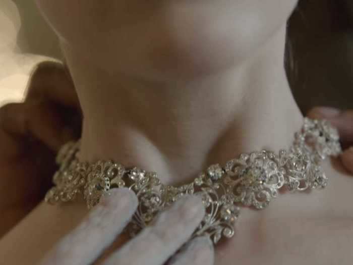 If her personal style is defined by simplicity, the necklace that the prince gifts her is "the other extreme," Mirojnick says. Daphne takes the necklace off in a dramatic scene.