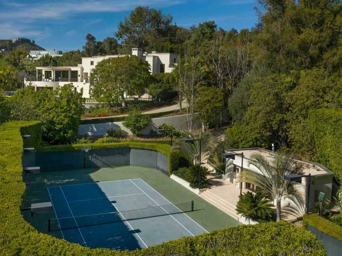 The grounds include a professional tennis court with an adjacent air-conditioned seating house and kitchenette.