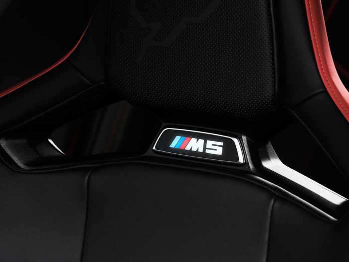 The headrests have M5 logos that light up in the dark.