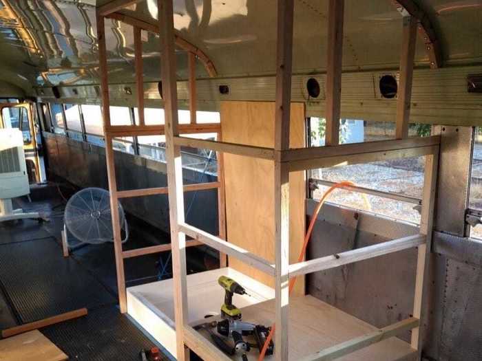 A contractor added a bathroom, which features a small sink, compost toilet, and shower.