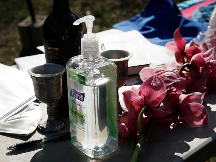 Hand sanitizer is now as much of a wedding essential as flowers are.