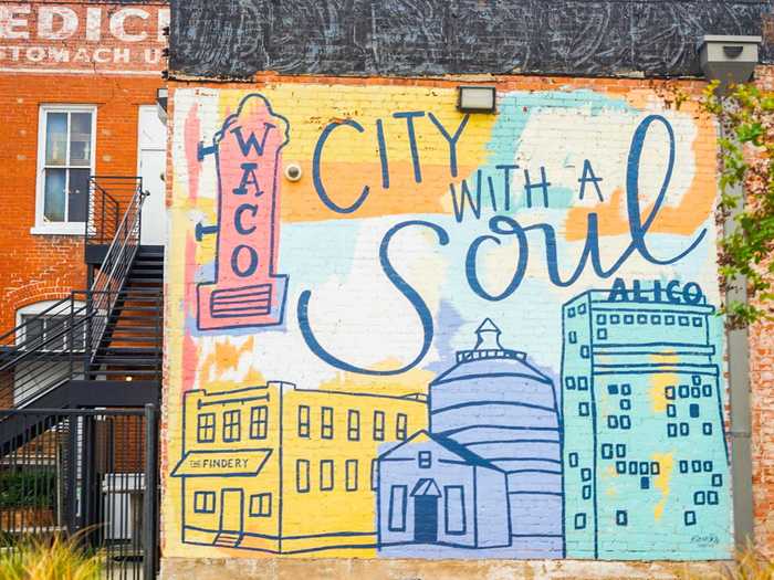 Just across the street, a larger and more colorful mural defines Waco as "a city with a soul."