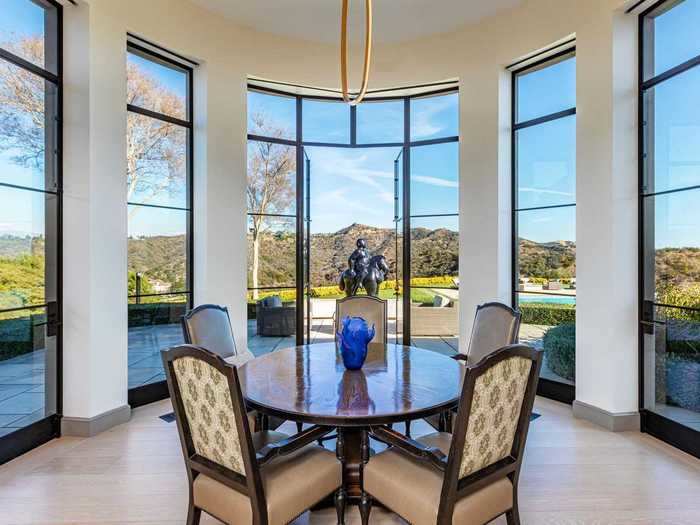 The dining nook in the kitchen looks out onto the home