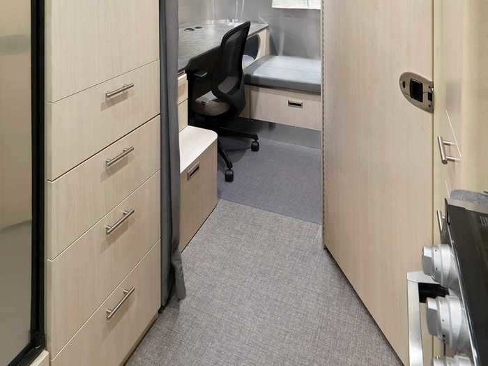 The desk also has storage units, a privacy divider …