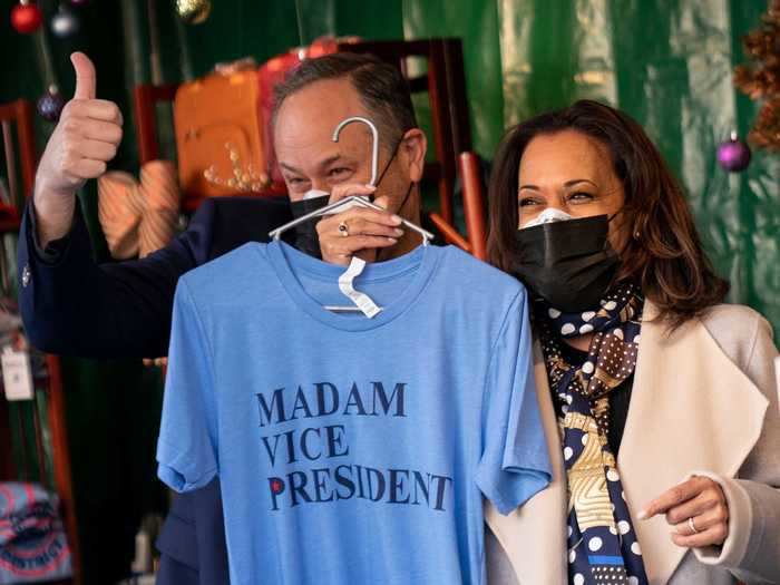 Ever the proud husband, Emhoff showed off a "Madam Vice President" T-shirt at a holiday market in Washington, DC.