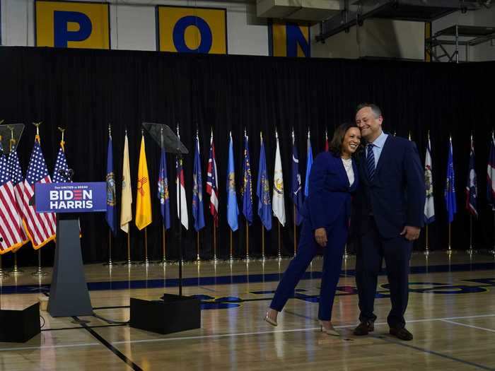 Harris leaned on Emhoff at their first press conference with the Bidens in August 2020.