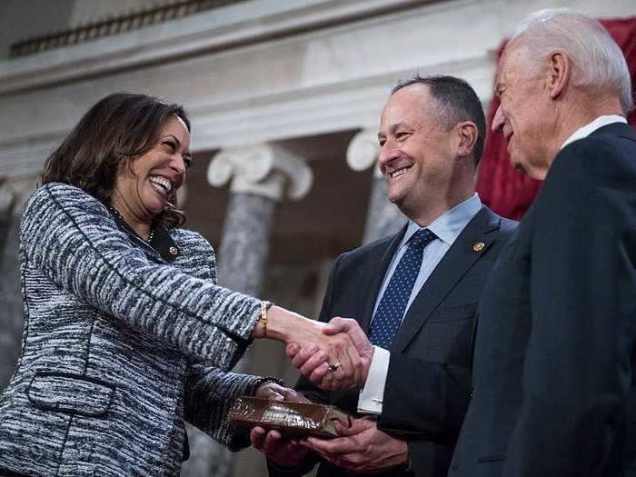 They grinned at each other as he held the Bible for Harris