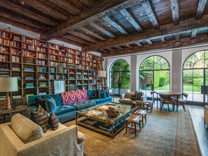 A secret bookshelf in the library opens to a custom-made speakeasy bar, and a secret staircase leads down to the wine cellar.