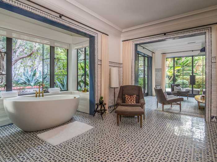 The bathrooms feature custom mosaic French marble floors.