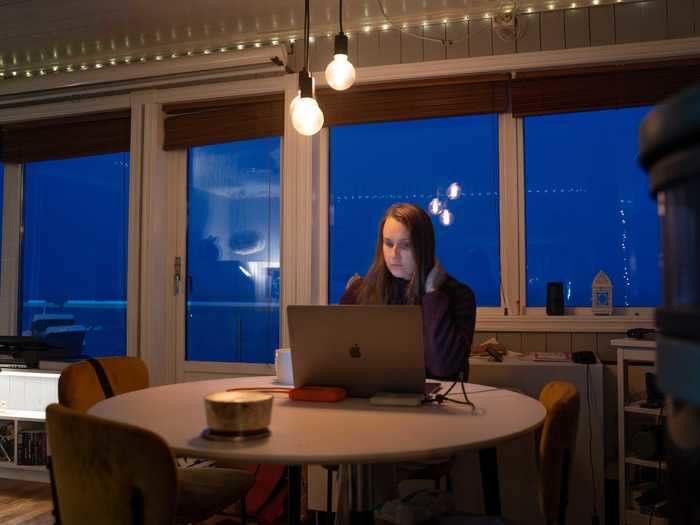 She then sits down at her dining table with her laptop as she doesn