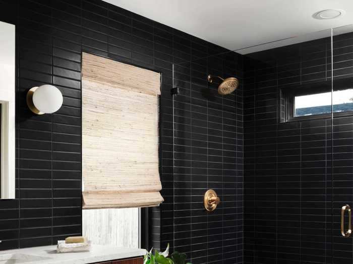 The black tile gives the bathroom a sophisticated feel.