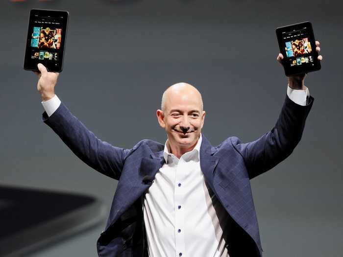 Throughout the 2000s, Bezos and company launched major new products and businesses for Amazon, including membership service Prime, the Kindle e-reader, the Echo smart speaker, and cloud-computing service Amazon Web Services, now known as AWS.