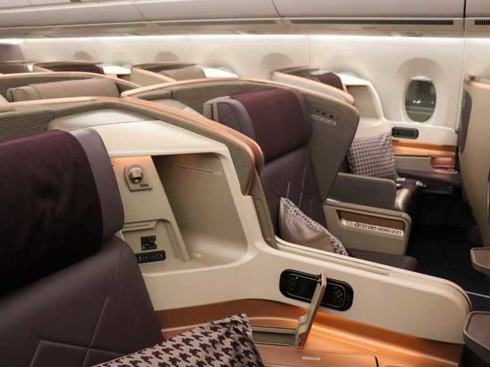 Couples might be more inclined to sit in the center aisle pairs, aptly nicknamed "honeymoon" seats.