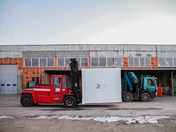 Homes are delivered by truck in compact shipping containers that weigh around 9,479 pounds.