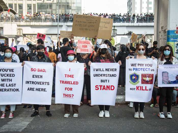 The coup is "so bad, even introverts are here," read one sign.