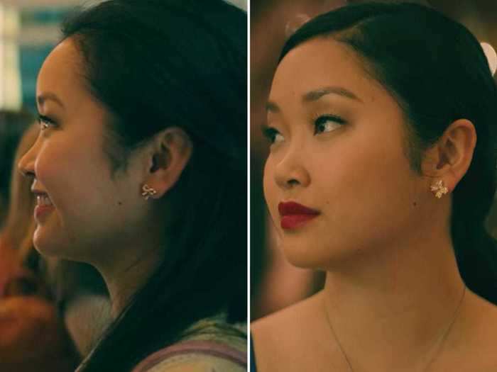 Lara Jean appears to re-wear her bow earrings from the second movie.