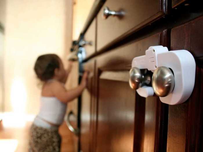 The pediatricians recommend locking cabinets with potentially harmful items like cleaners, heavy pots, spices, and detergents.