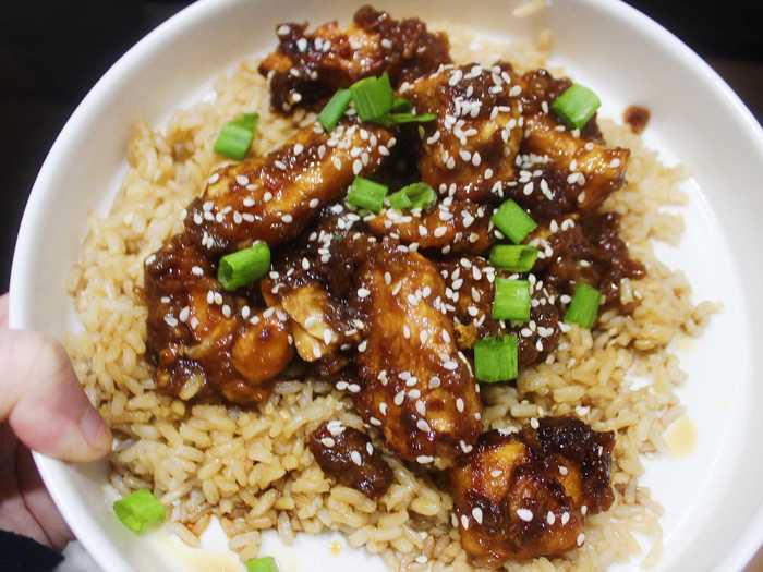 I paired my chicken with microwaved brown rice, which I already had in my pantry, and topped it all with white sesame seeds and chopped green onion.