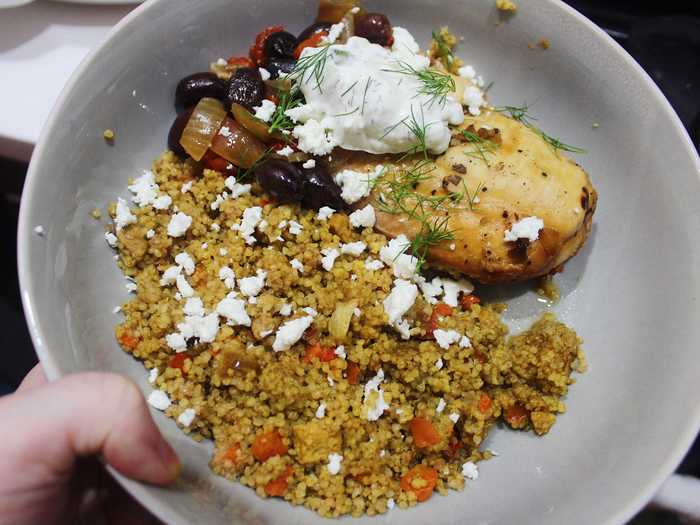 I served my chicken and vegetables with feta cheese, some microwaved rice, and a little tzatziki sauce.