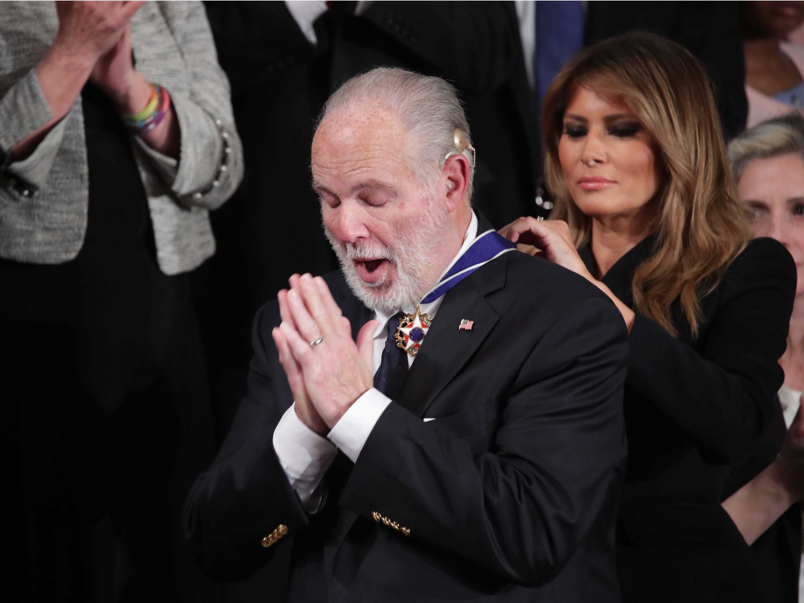 First lady Melania Trump places a Presidential Medal of Freedom to Rush Limbaugh during U.S. President Donald Trump