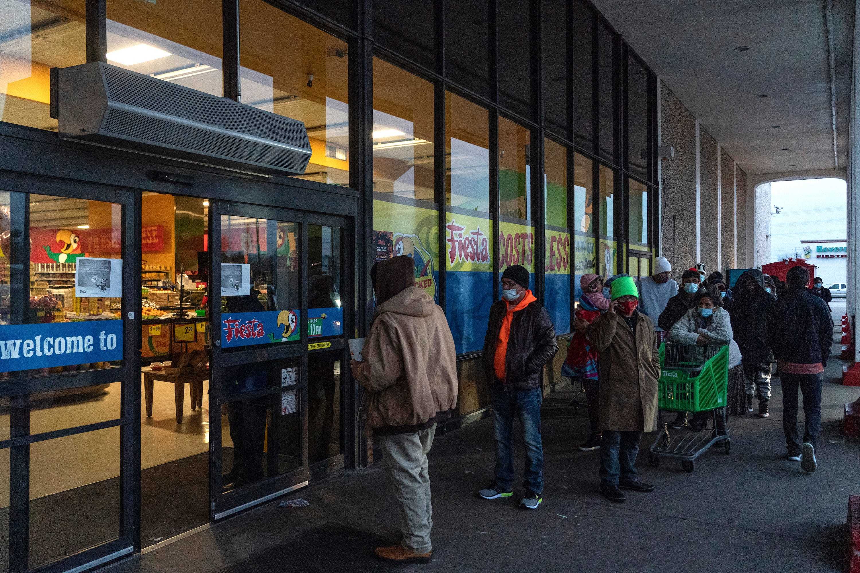 People wait in line to enter Fiesta supermarket on February 16, 2021 in Houston, Texas.