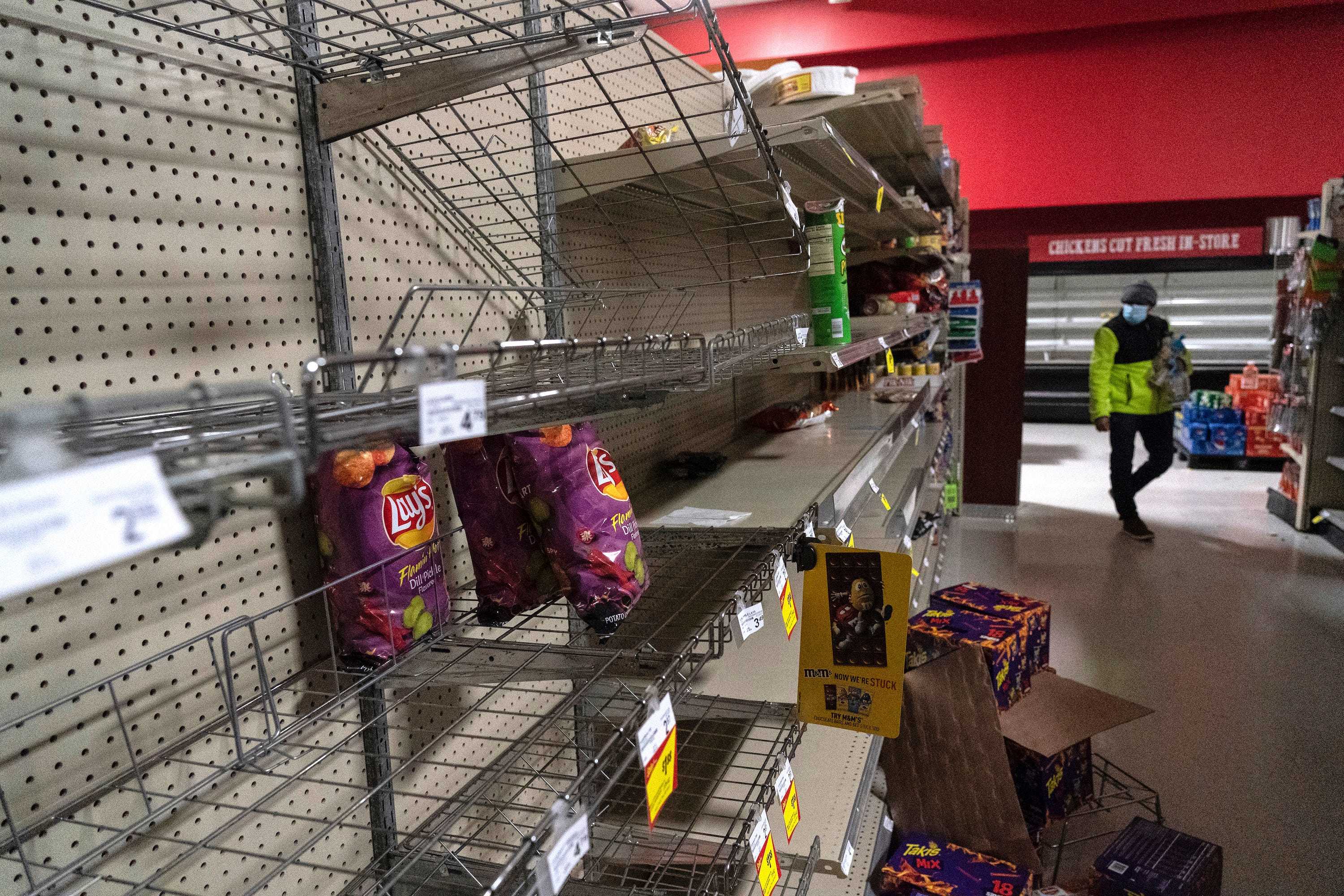 Snack shelves are seen nearly empty in Fiesta supermarket on February 16, 2021 in Houston, Texas.