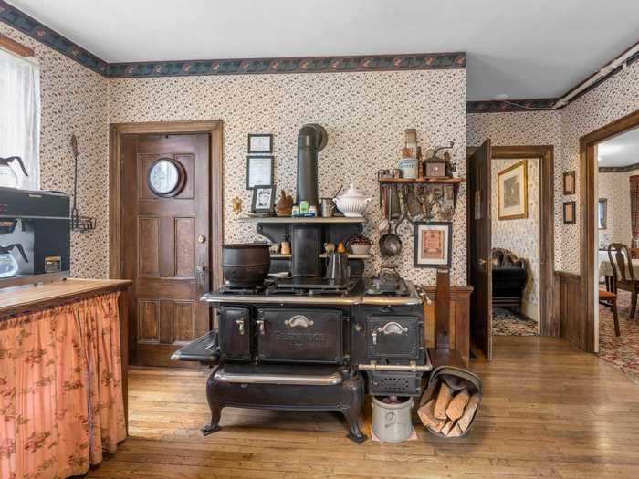 The kitchen, which is also located on the first floor, has an old-fashioned wood-burning stove that certainly looks like a throwback to the 1800s.