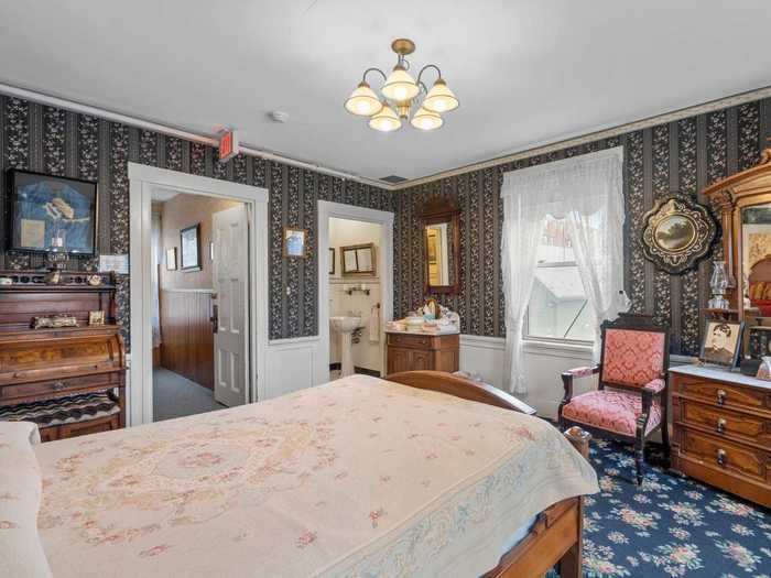 The property has plenty of relics from the time the home was built, like sewing machines, lanterns, and mannequins with floor-length era-appropriate dresses.