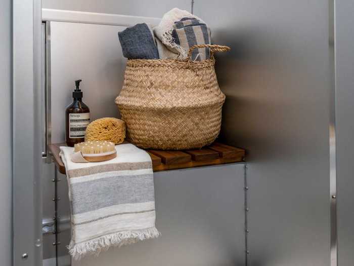 ... and an en suite bathroom, which houses the shower, vanity medicine cabinet, mirror, and sink.