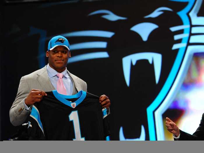 Cam Newton was selected by the Carolina Panthers with the number one overall pick in 2011 out of Auburn after a college career that was highlighted by a national championship victory in 2010.