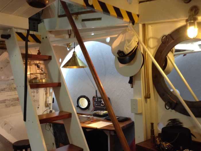 In a side area created by one of the radar domes, Keith and Jen fashioned a desk from an old oak headboard.