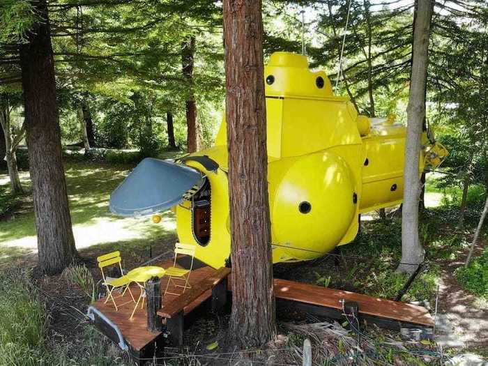 A New Zealand couple has built a two-story tiny home shaped like a yellow submarine.