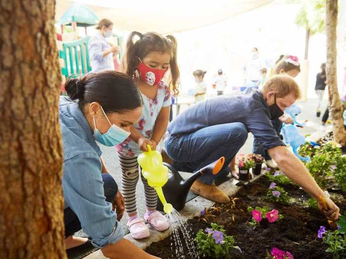 August 2020: Markle and Harry plant flowers in honor of Princess Diana on the anniversary of her death.