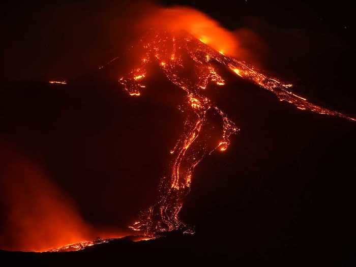 Here is a closer look at the glowing river of lava running down the volcano throughout the night.