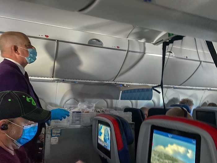 Then it was off to Salt Lake City. Soon after takeoff, gloved flight attendants went up and down the aisle to offer complimentary headphones and begin the in-flight service.