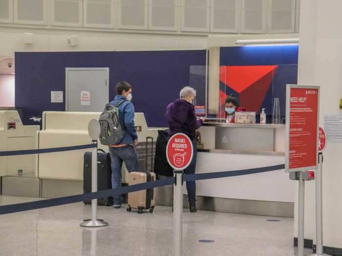 Delta had completely overhauled the ticketing area more so than other airlines with social distancing floor placards, plexiglass partitions, and mask reminders.