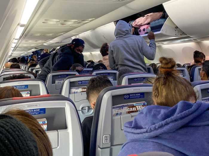 A reminder to social distance during deplaning, however, went unheeded and most flyers defaulted to the norm of standing in the aisle as soon as the seatbelt sign turned off. This is common on any airline, not just American.