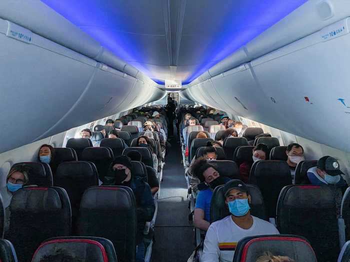 After the service, I walked around the plane and noticed multiple passengers flouting the mask mandate. Some either had the covering under their nose or off entirely.