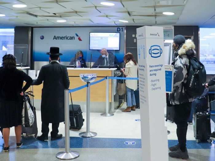 Here, there were more plexiglass partitions, social distancing stanchions, and even floor placards to remind folks of social distance and of the new onboard mask requirements.